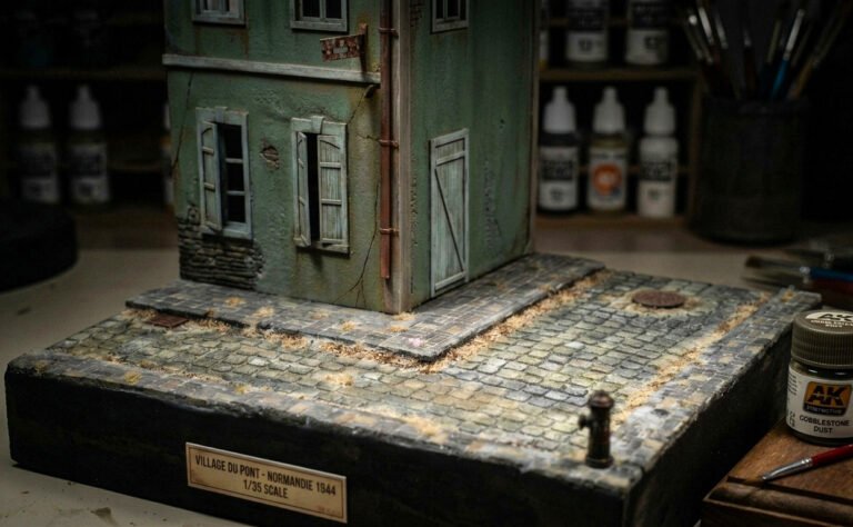 WWII diorama with cobblestone road and building by Scale Wonderland